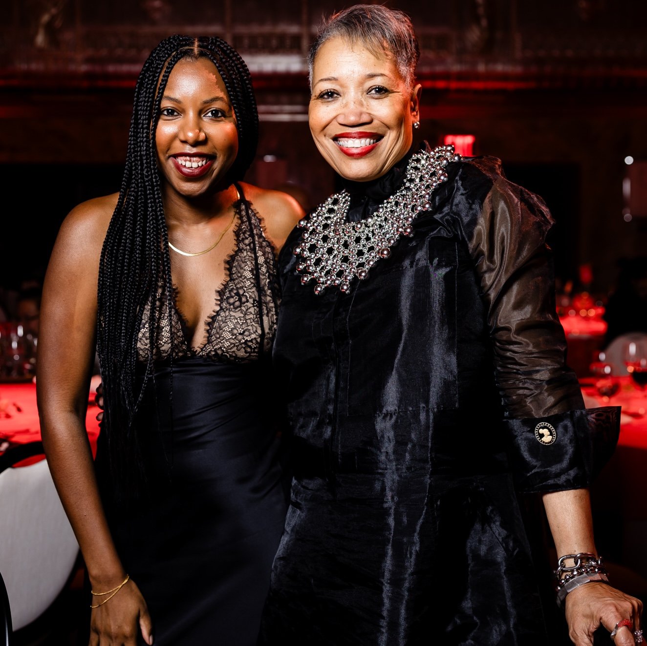 Two attendees posing together at the Interior Design Hall of Fame gala.