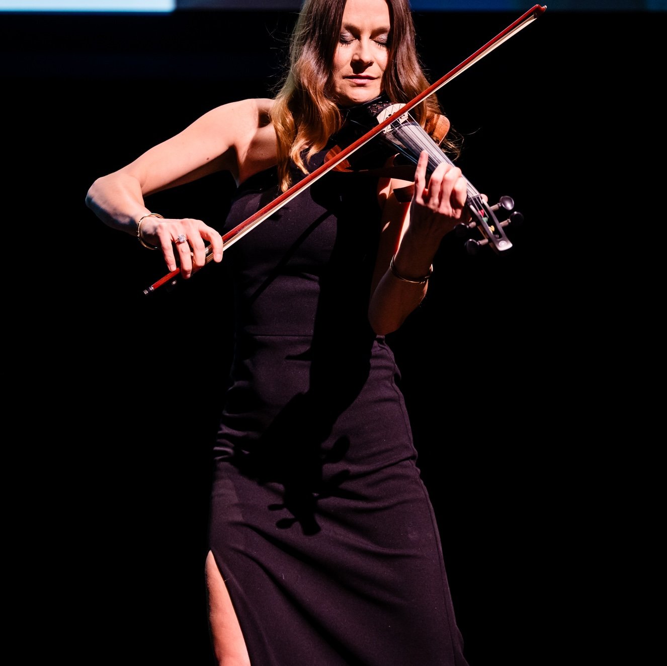 Violinist performing onstage during the Interior Design Hall of Fame gala.